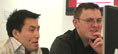 Two men discussing work infront of computer