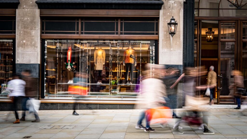 People walking outside a retail store