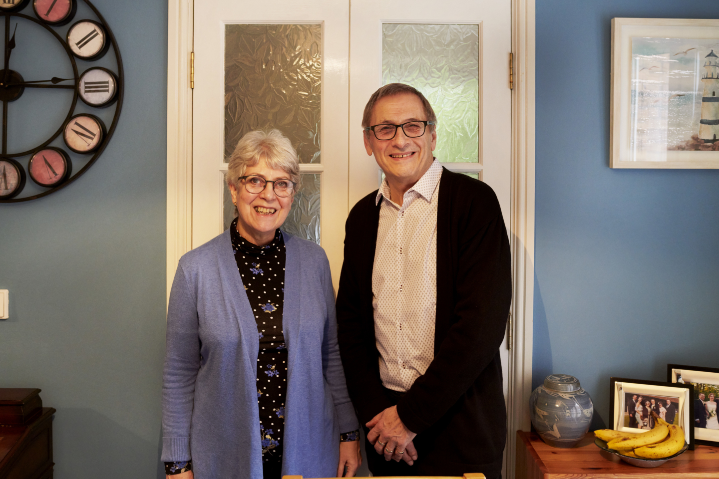 Miriam and Derek standing in their home