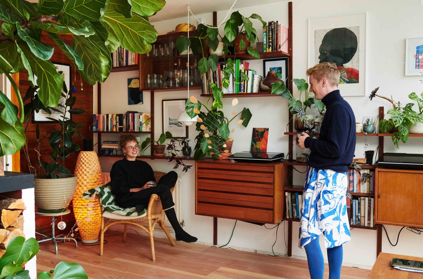 Two people in a lounge chatting