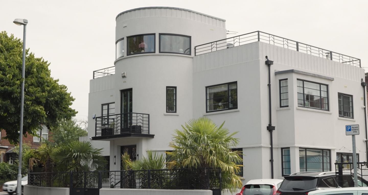 An Art Deco house surrounded by trees