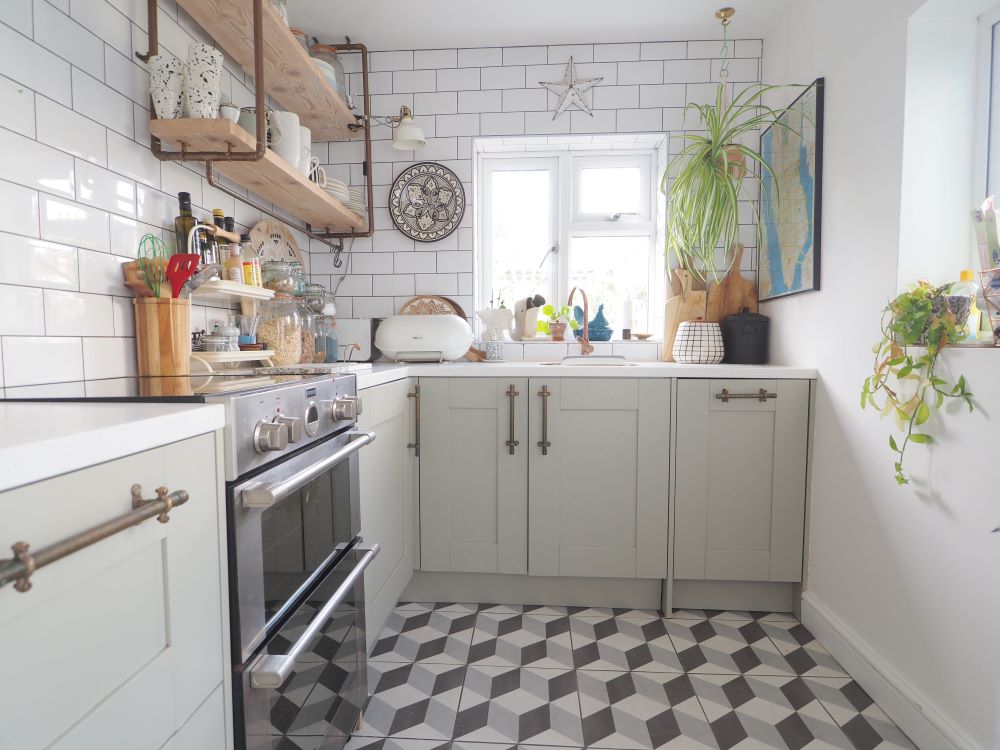 A kitchen with a range cooker, shelving