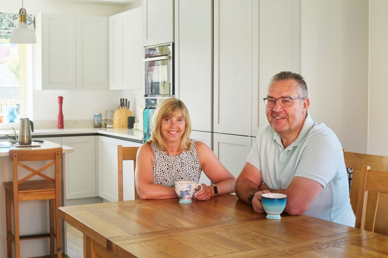 Two people sitting at a dining table