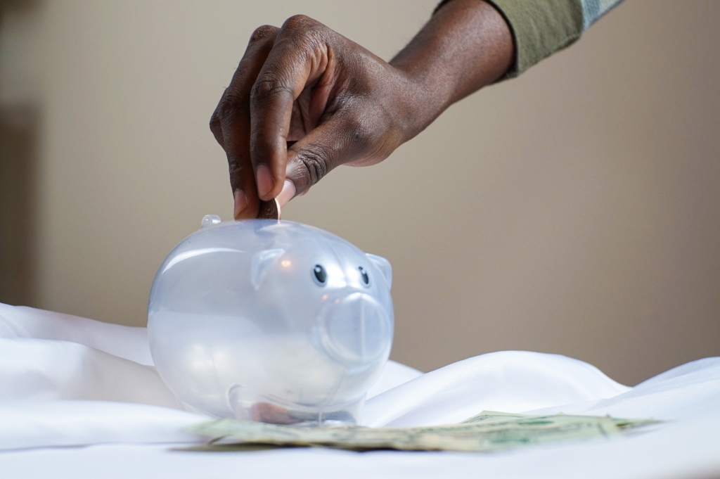 saving money in a piggy box