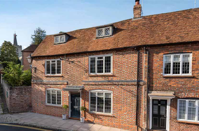 A historic red brick house in the countryside
