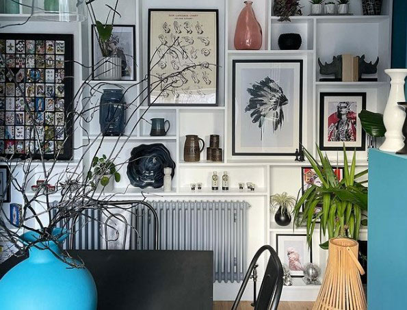A dining area, lots of pictures on the walls