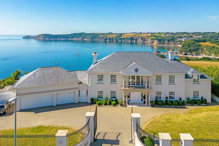 A detached home with views of the sea and clifftops