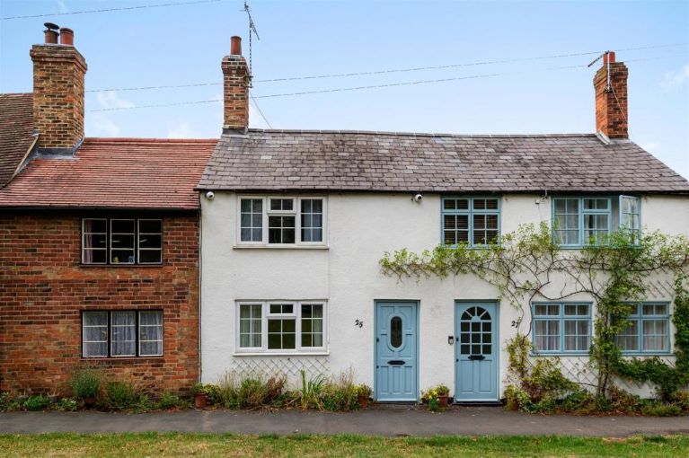 White terraced cottages with blue front doors