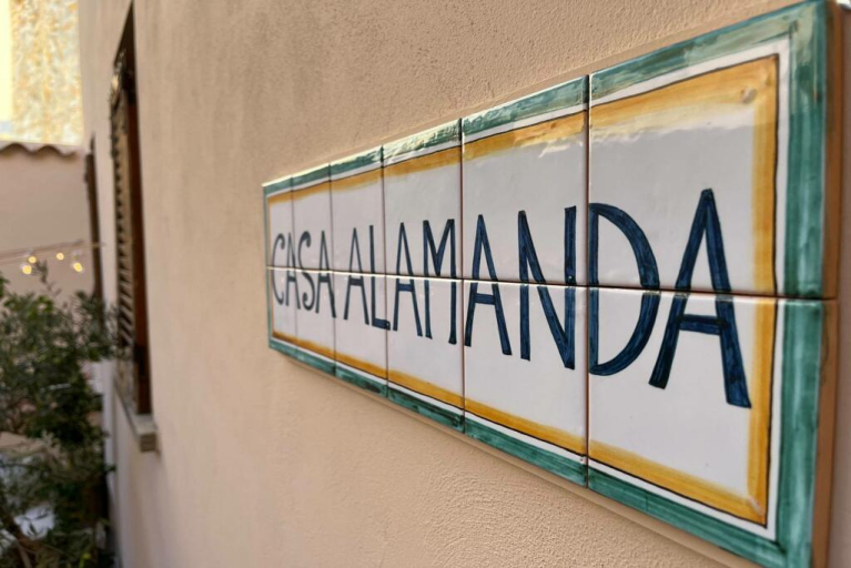 A tiled sign for Casa Alamanda
