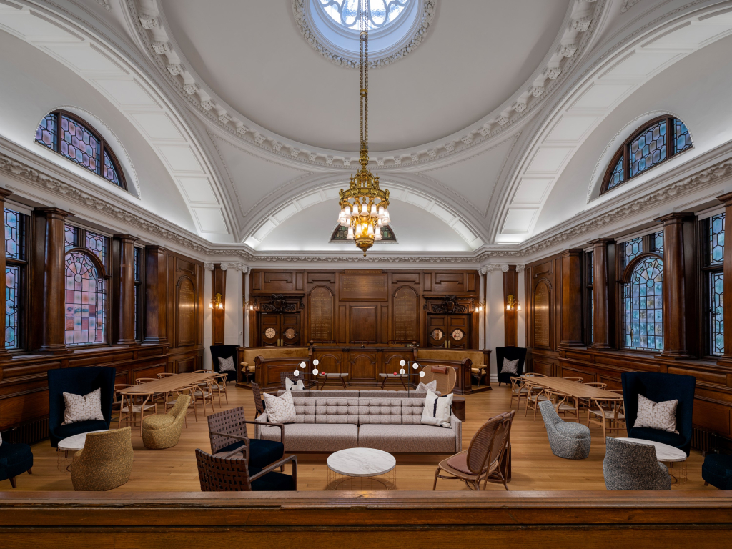 A period-style room with a domed ceiling, wood-panelled walls