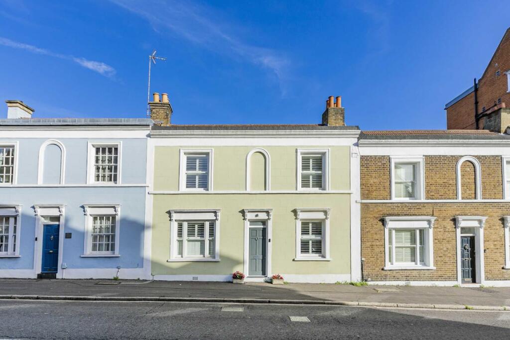 Pastel coloured townhouses in the sunshine