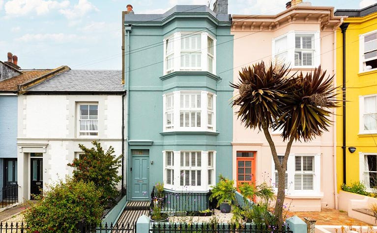 A row of colourful terraced houses in Brighton