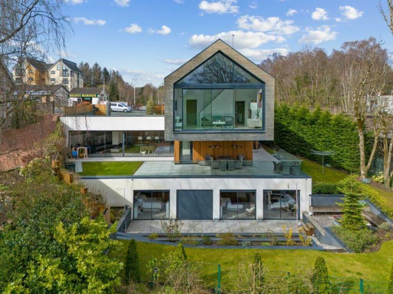 Floating house in Scotland surrounded by trees