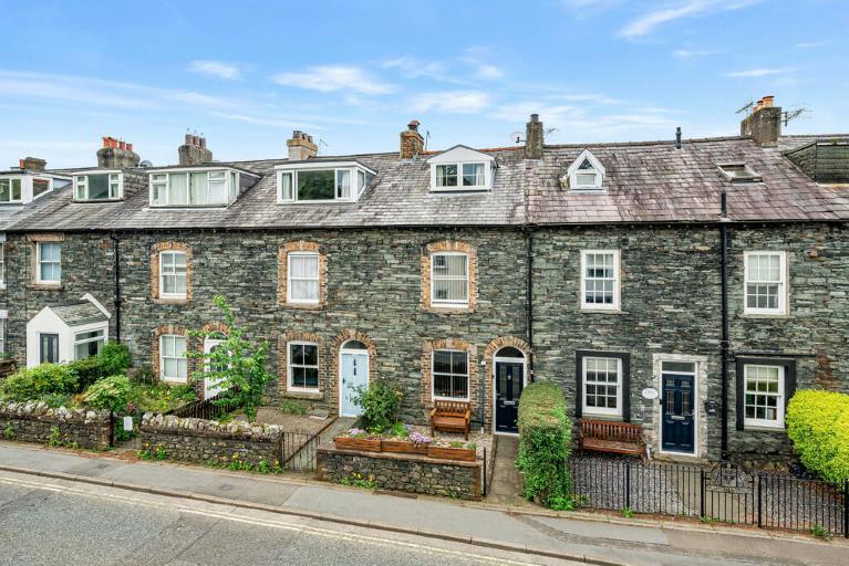 A row of terraced slate-fronted houses