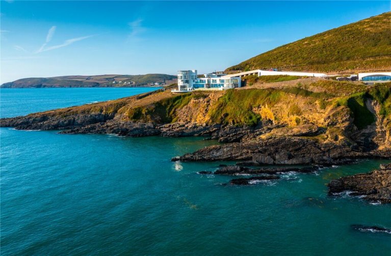 A house on the coast, blue sky, sea