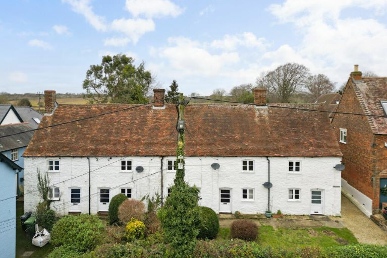 White cottages with tiled roofs, blue sky