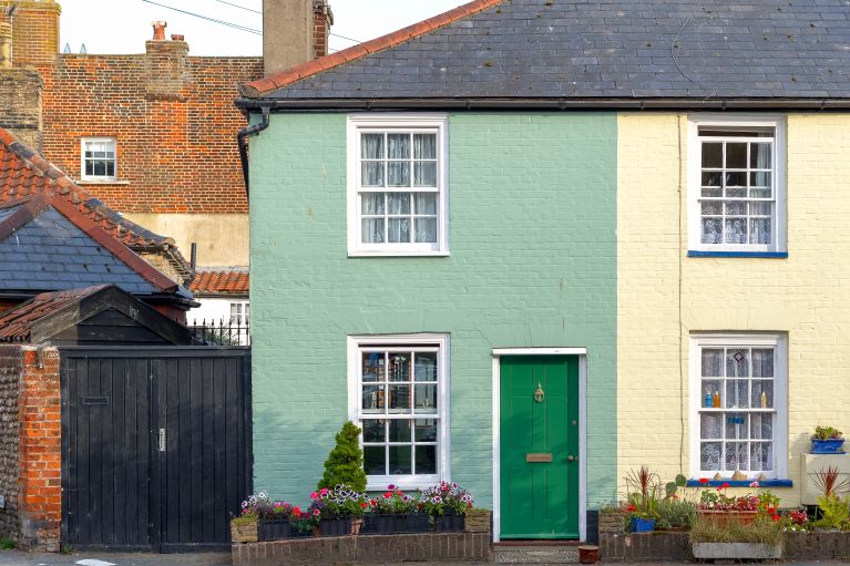 A green house, a garage door