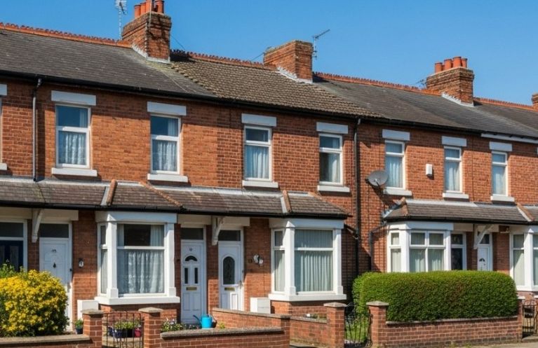 A row of terraced red brick houses