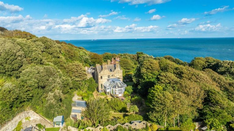 A house, trees, the sea