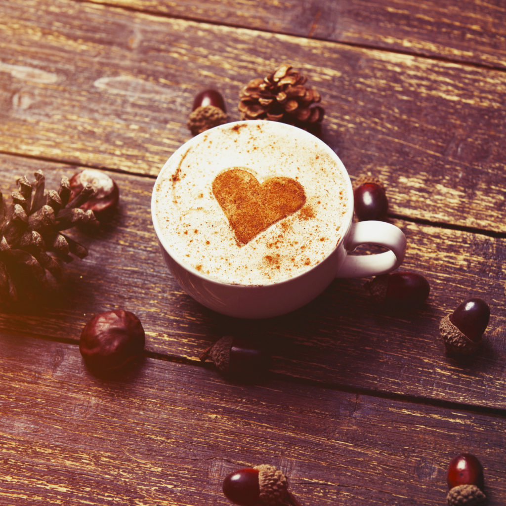 Cup of coffee on wooden background