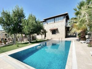 beautiful brick villa with a pool